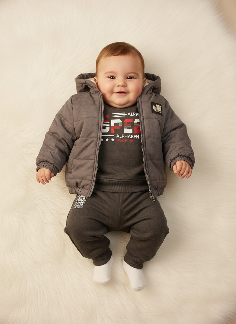 Baby laying down in Alphabet outfit - full view